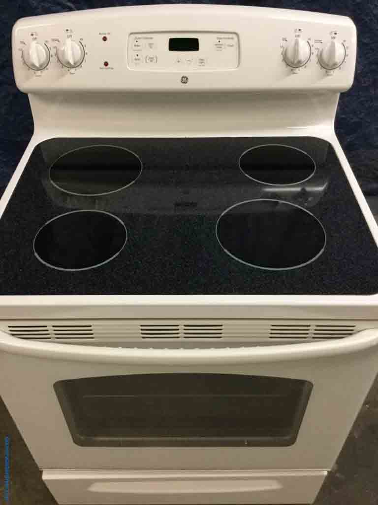 White Refrigerator w/ice-maker and White Electric Range